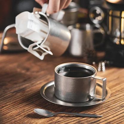 Taza de café de acero inoxidable con platillo y cuchara a juego